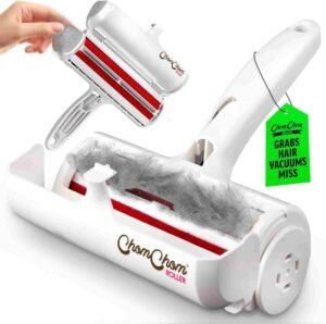 Reusable pet hair remover collecting dog and cat hair from couch upholstery with built-in self-cleaning chamber